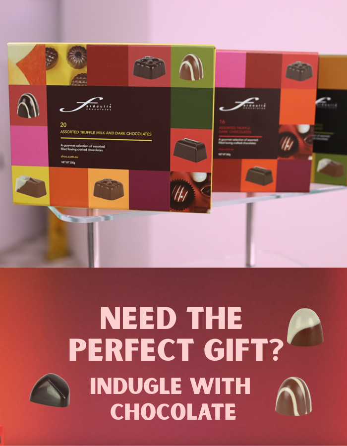 “Festive chocolate gift box with handmade gourmet chocolates in holiday packaging – perfect for Christmas gifting.”