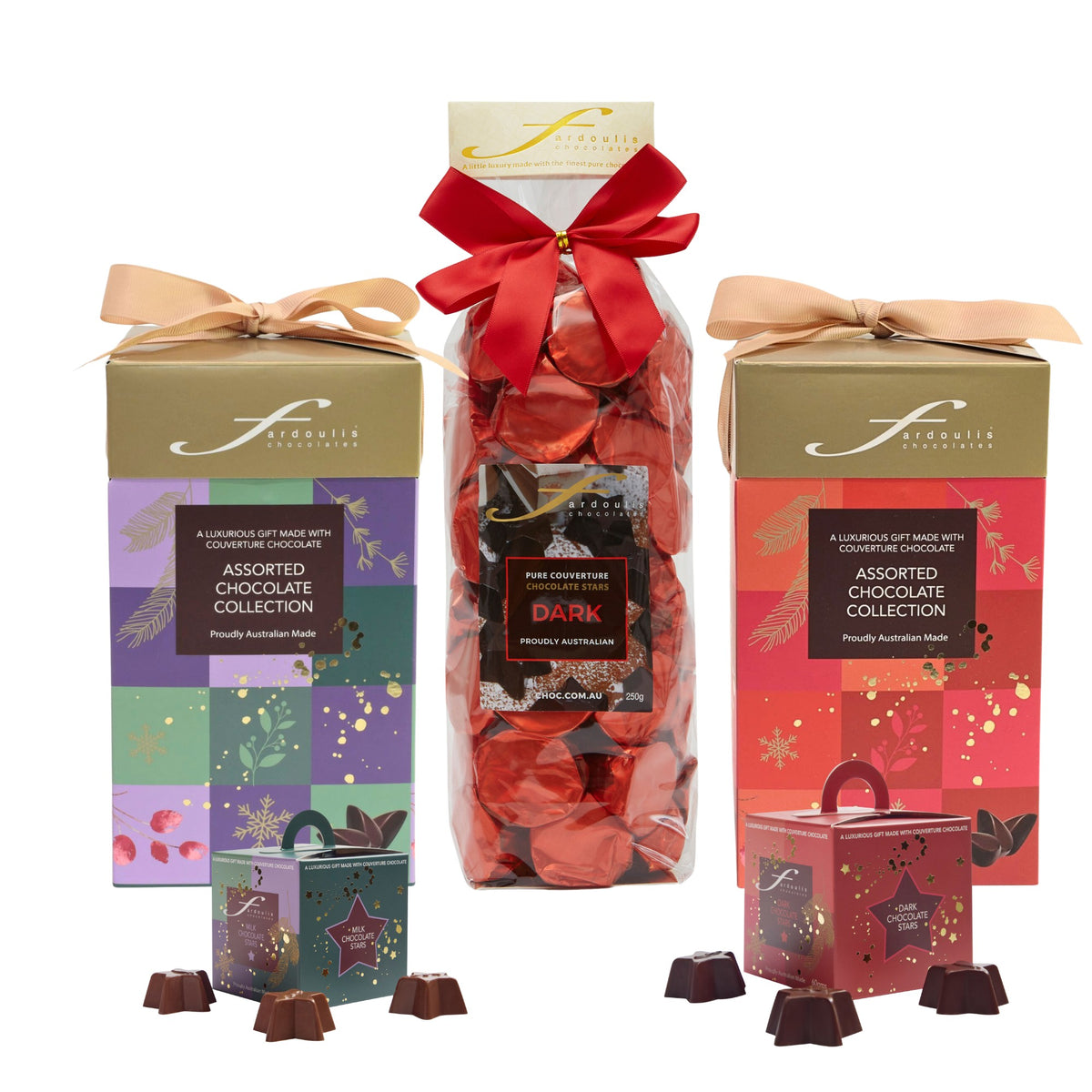 Fardoulis Christmas chocolate gift selection with two ribbon-tied tall boxes, a dark chocolate stars gift bag, and milk and dark chocolate star boxes.”