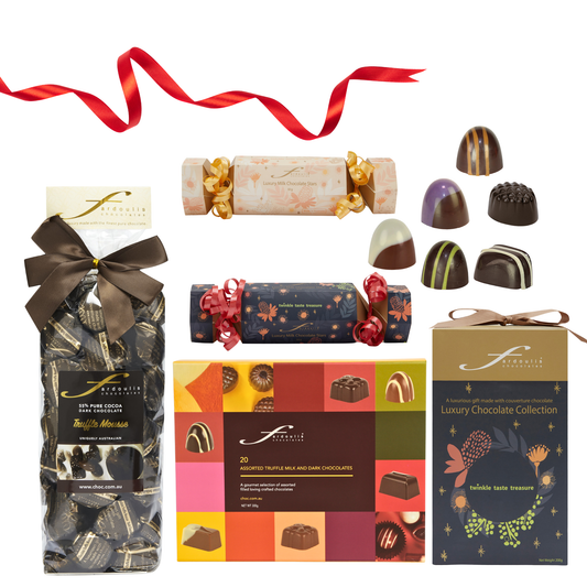 Fardoulis Chocolates Christmas gift box featuring vibrant festive packaging with red and gold accents, filled with handcrafted crème ganache chocolates.