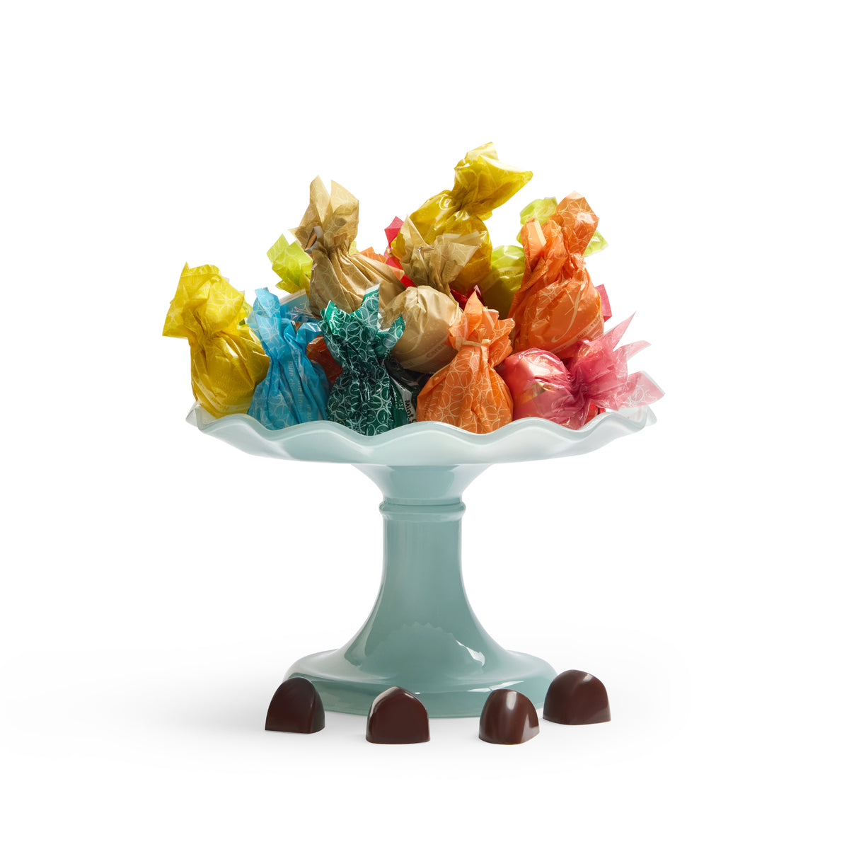 “Fardoulis chocolates in colourful wrappers on a pale blue pedestal stand, with four unwrapped chocolates in front.”