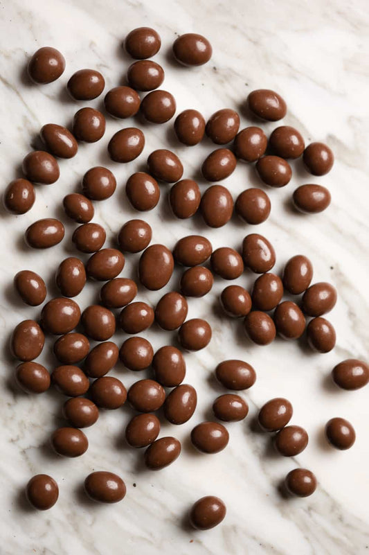 Milk chocolate coated sultanas – sweet dried fruit covered in creamy milk chocolate