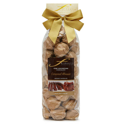 Smooth and sweet caramel mousse filled epicurean chocolates in a gift bag — made with pure couverture chocolate. A delightful gift from Fardoulis Chocolates.