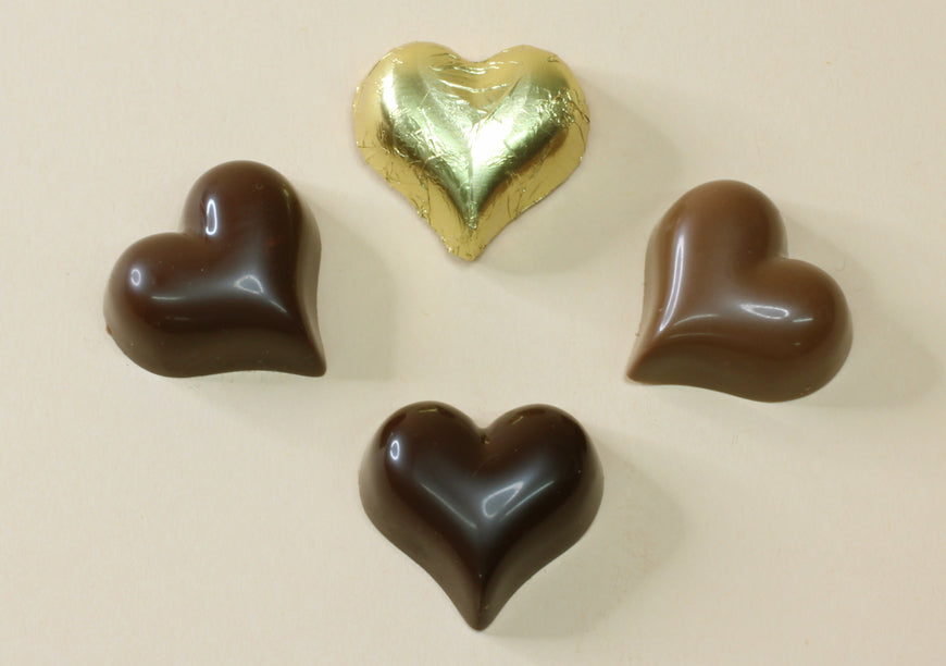 Shop shiny gold foiled chocolate hearts in 16 flavours, from milk and dark chocolate to praline, mousse and truffle. Perfect for favours and gifts.