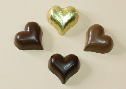 Shop shiny gold foiled chocolate hearts in 16 flavours, from milk and dark chocolate to praline, mousse and truffle. Perfect for favours and gifts.