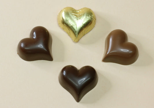 Shop shiny gold foiled chocolate hearts in 16 flavours, from milk and dark chocolate to praline, mousse and truffle. Perfect for favours and gifts.
