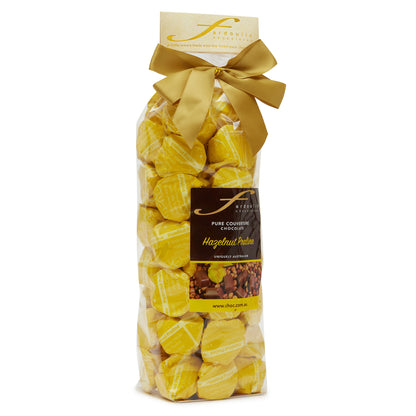 Rich hazelnut praline filled epicurean chocolates in a gift bag — made with pure couverture chocolate. A nutty indulgence from Fardoulis Chocolates.