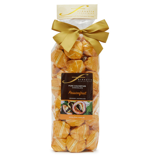 Exotic passionfruit creme filled epicurean chocolates in a gift bag — wrapped in pure couverture chocolate. A tropical treat from Fardoulis Chocolates.
