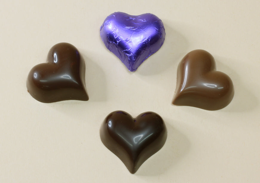 Shop purple foil heart chocolates made with pure couverture chocolate. Choose solid milk or solid dark chocolate for wedding favours, gifts and special events.