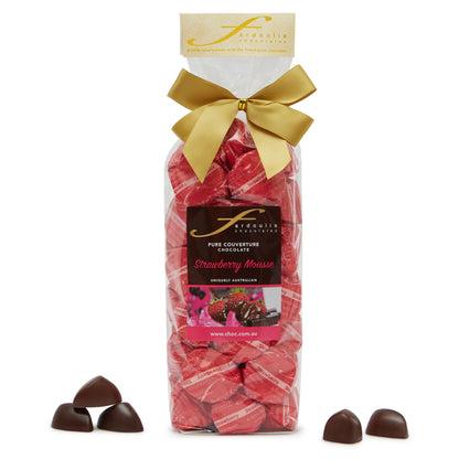 Indulge in our Strawberry Mousse chocolate gift bag — 25 strawberry ganache filled epicurean chocolates wrapped in pure couverture chocolate. A perfect sweet gift from Fardoulis Chocolates.