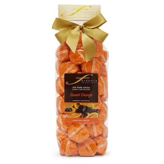 Zesty sunset orange truffle filled epicurean chocolates in a gift bag — made with pure couverture chocolate. A vibrant gift from Fardoulis Chocolates.