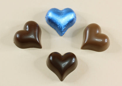 Shop blue foil heart chocolates made with pure couverture chocolate. Choose solid milk or solid dark chocolate for wedding favours, gifts and special events.