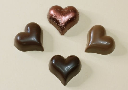 Shop brown foiled chocolate hearts by the unit in Mocca Coffee, milk or dark chocolate, made from pure couverture chocolate. Perfect for wedding favours and gifts.