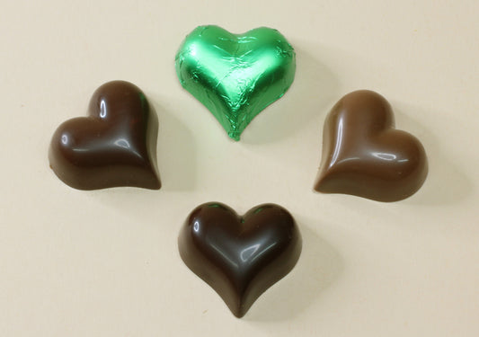 Shop green foiled chocolate hearts in passionfruit, milk or dark chocolate, made from pure couverture chocolate. Perfect for favours and gifts.
