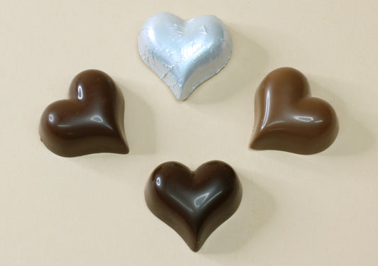 Shop matt silver foil heart chocolates made with pure couverture chocolate. Choose solid milk or solid dark chocolate for favours, gifts and special events.